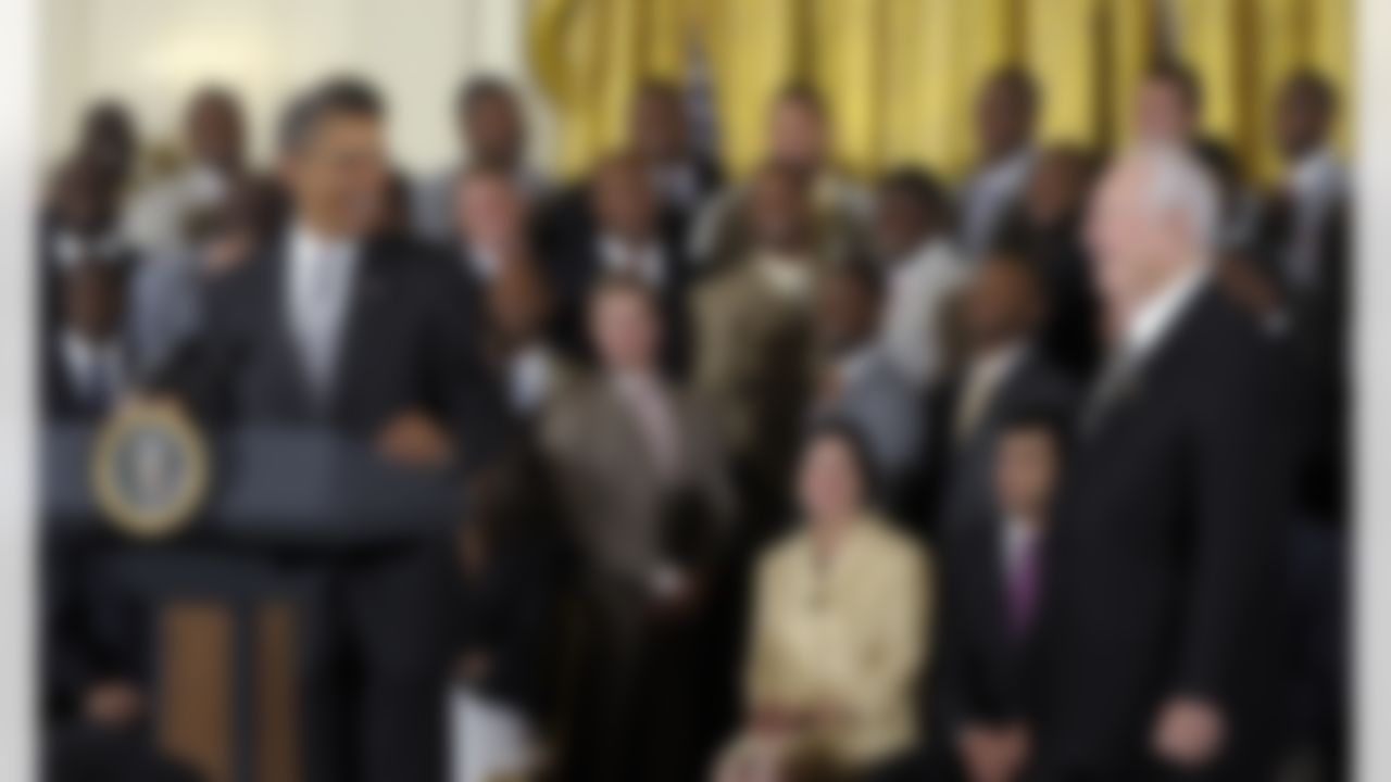 President Barack Obama talks to New Orleans Saints owner Tom Benson, right, in the East Room of the White House in Washington, Monday, Aug. 9, 2010, during a ceremony where the president honored 2009 Super Bowl Champion New Orleans Saints NFL football team. (AP Photo/Susan Walsh)