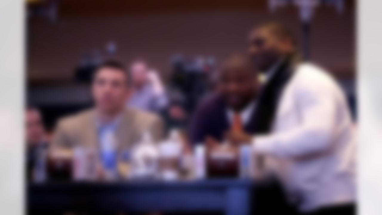 Former NFL players Kurt Warner, from left, Warren Sapp and LaDainian Tomlinson watch a video presentation during a news conference in which the NFL announced the launch of NFL Now, a multimedia effort to engage fans with the league, Thursday, Jan. 30, 2014, in New York, N.J. The Seattle Seahawks are scheduled to play the Denver Broncos in the NFL Super Bowl XLVIII football game on Sunday, Feb. 2, at MetLife Stadium in East Rutherford, N.J. (AP Photo)
