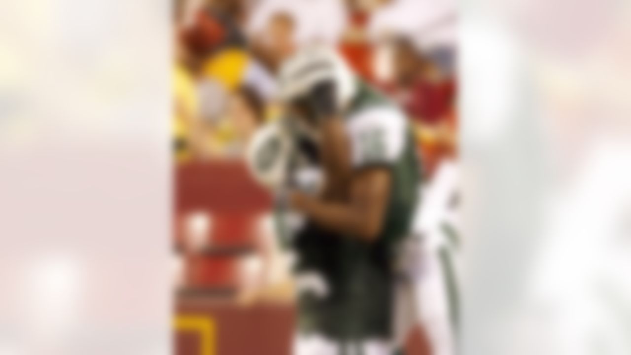 Jets wide receiver Brad Smith (16) celebrates scoring a touchdown with a teammate during an NFL game at FedEx Field in Landover, MD on Saturday, August 19, 2006. The Jets defeated the Redskins 27-14. Photo by Rafael Suanes/Getty Images.
