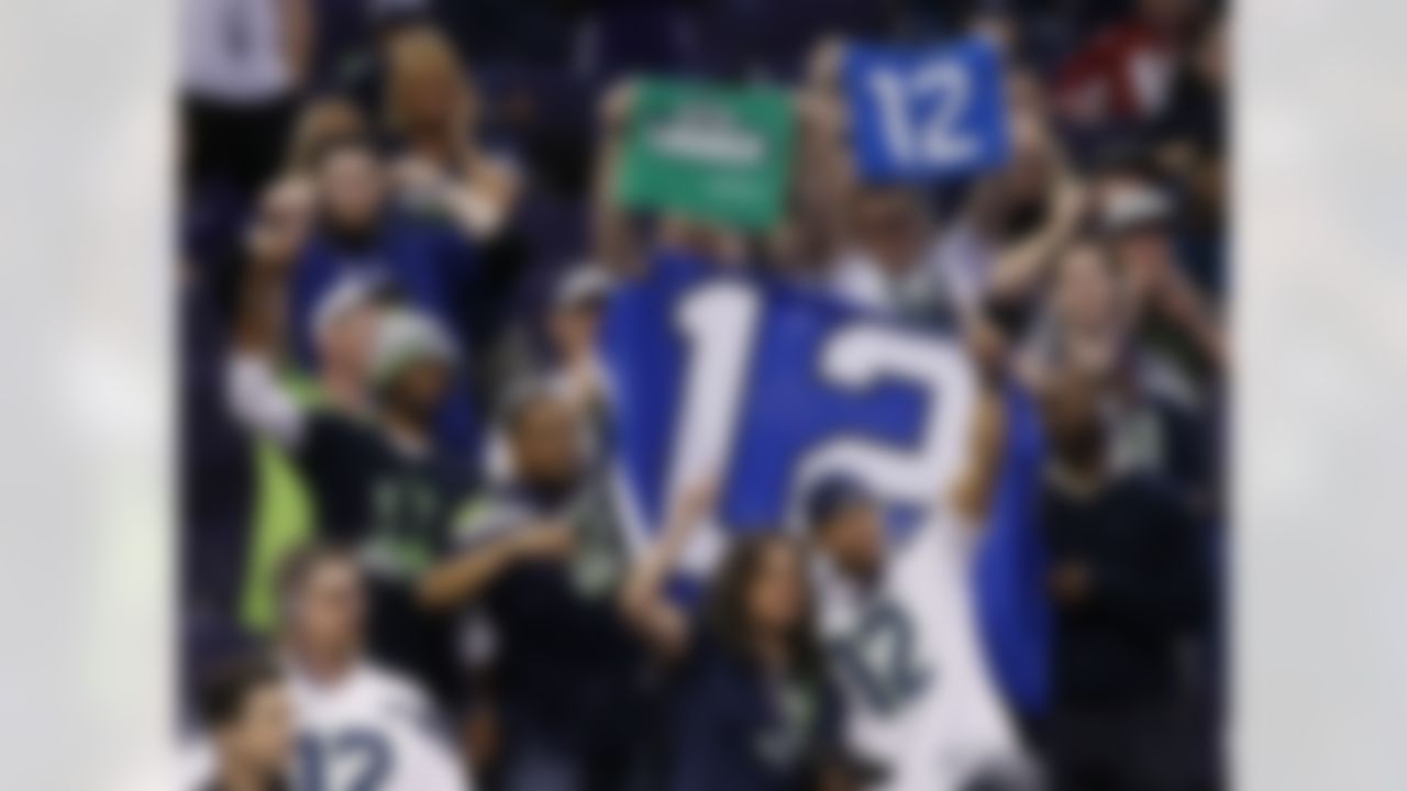 Seattle Seahawks fans cheer during media day for NFL Super Bowl XLIX football game Tuesday, Jan. 27, 2015, in Phoenix. (AP Photo/Matt York)