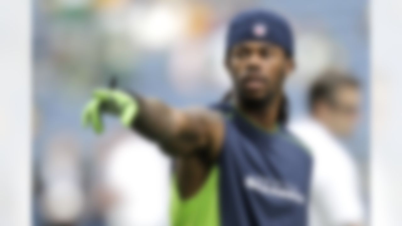 Seattle Seahawks wide receiver Sidney Rice, wearing a New Era cap, warms up before the NFL football game against the Green Bay Packers, Monday, Sept. 24, 2012, in Seattle. (AP Photo/Ted S. Warren)
