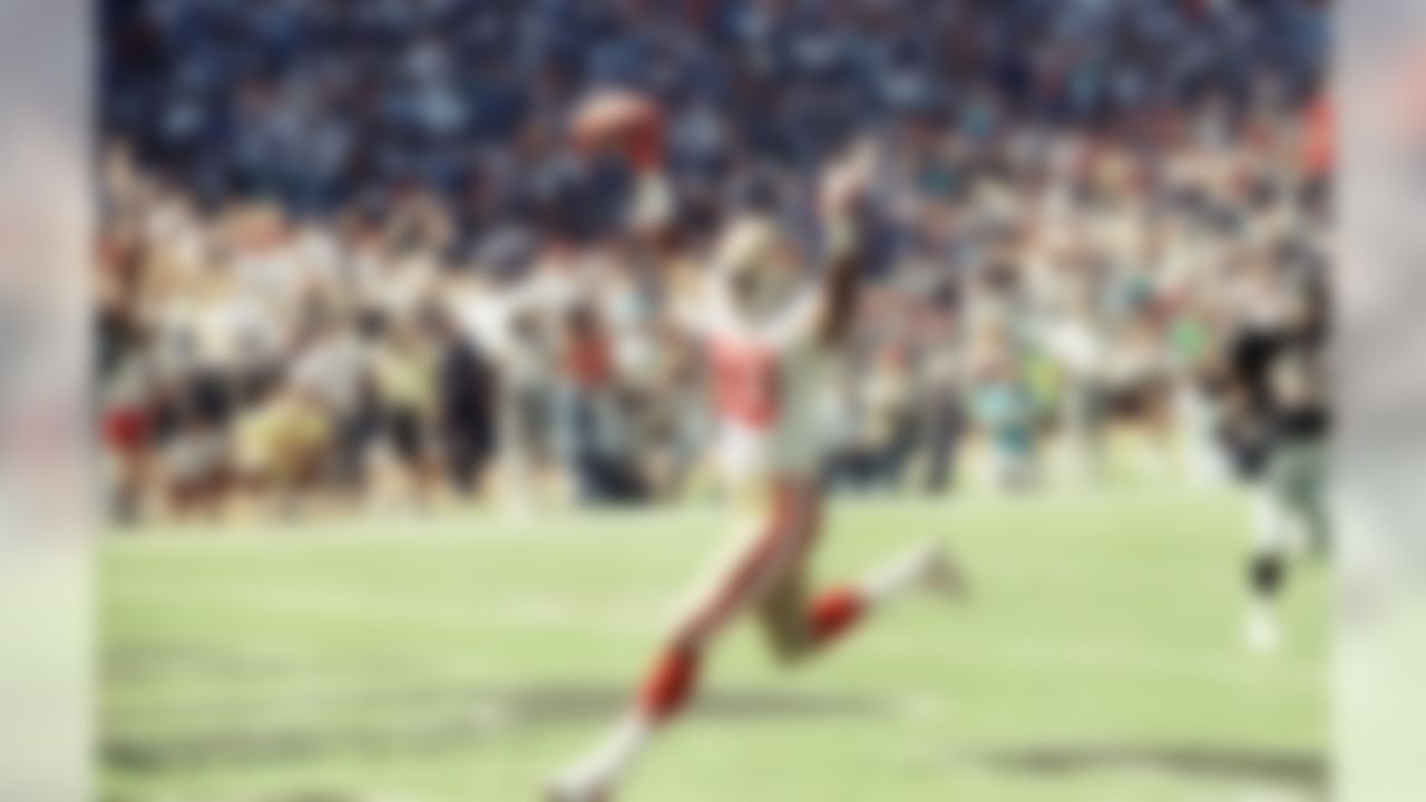 Jerry Rice(80) of the San Francisco 49ers scores a touchdown against the Atlanta Falcons during the first minute of the game during action on Sunday, Oct. 14, 1990 in Atlanta. (AP Photo/Curtis Compton)