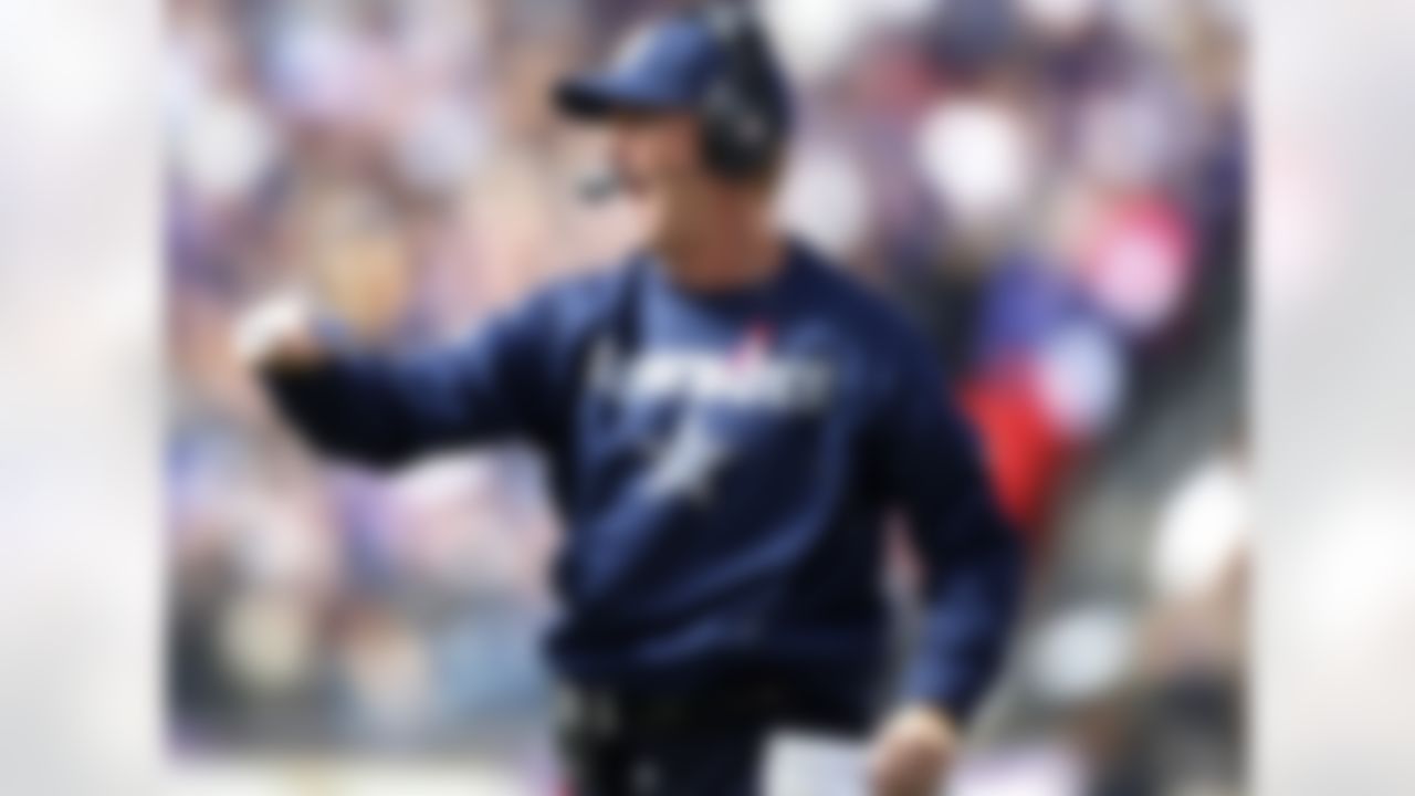 Dallas Cowboys head coach Jason Garrett celebrates a touchdown during an NFL football game against the Baltimore Ravens on Sunday, October 14, 2012, at M&T Bank Stadium in Baltimore, Maryland. The Ravens defeated the Cowboys, 31-29. (AP Photo/James D Smith)