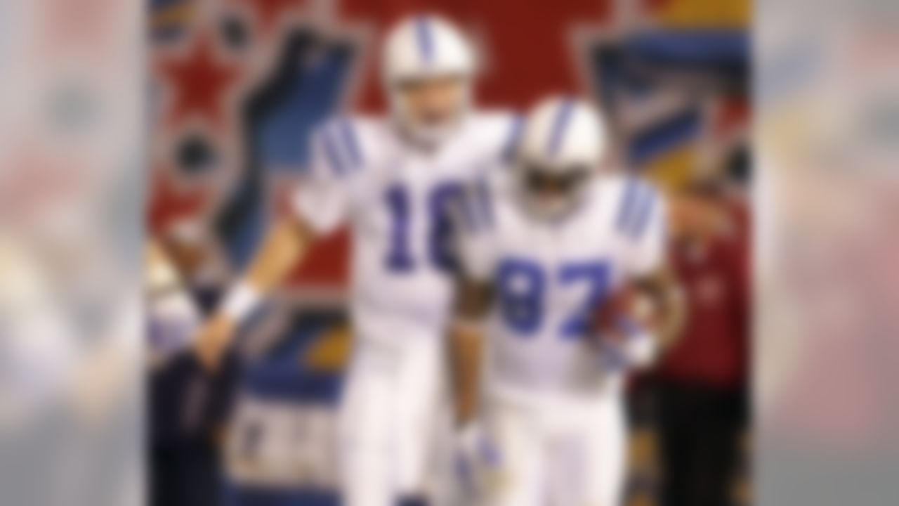 Indianapolis Colts quarterback Peyton Manning, left, greets wide receiver Reggie Wayne after Wayne's touch down against the San Diego Chargers during the third quarter of an NFL AFC wild-card playoff football game Saturday, Jan. 3, 2009 in San Diego. (AP Photo/Chris Park)