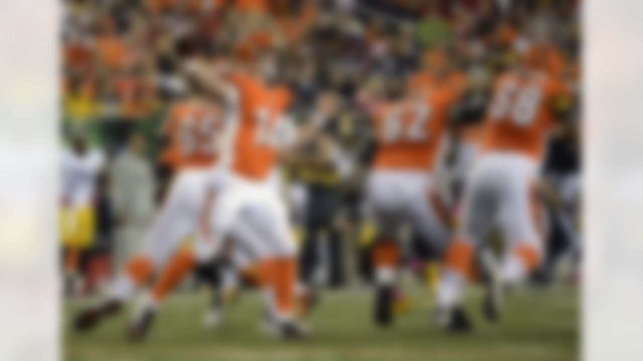 Cincinnati Bengals quarterback Andy Dalton (14) passes against the Pittsburgh Steelers in the first half of an NFL football game, Sunday, Oct. 21, 2012, in Cincinnati. (AP Photo/Michael Keating)