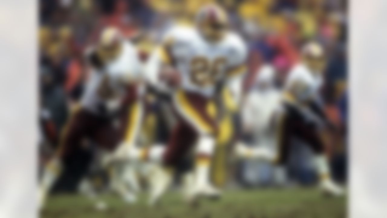 Washington Redskins cornerback Darrell Green (28) runs with the football after intercepting a pass, but the play was nullified by a penalty during the Redskins 24-7 victory over the Atlanta Falcons in the 1991 NFC Divisional Playoff Game on January 4, 1992 at RFK Stadium in Washington, D.C. (Photo by Al Messerschmidt/NFL)