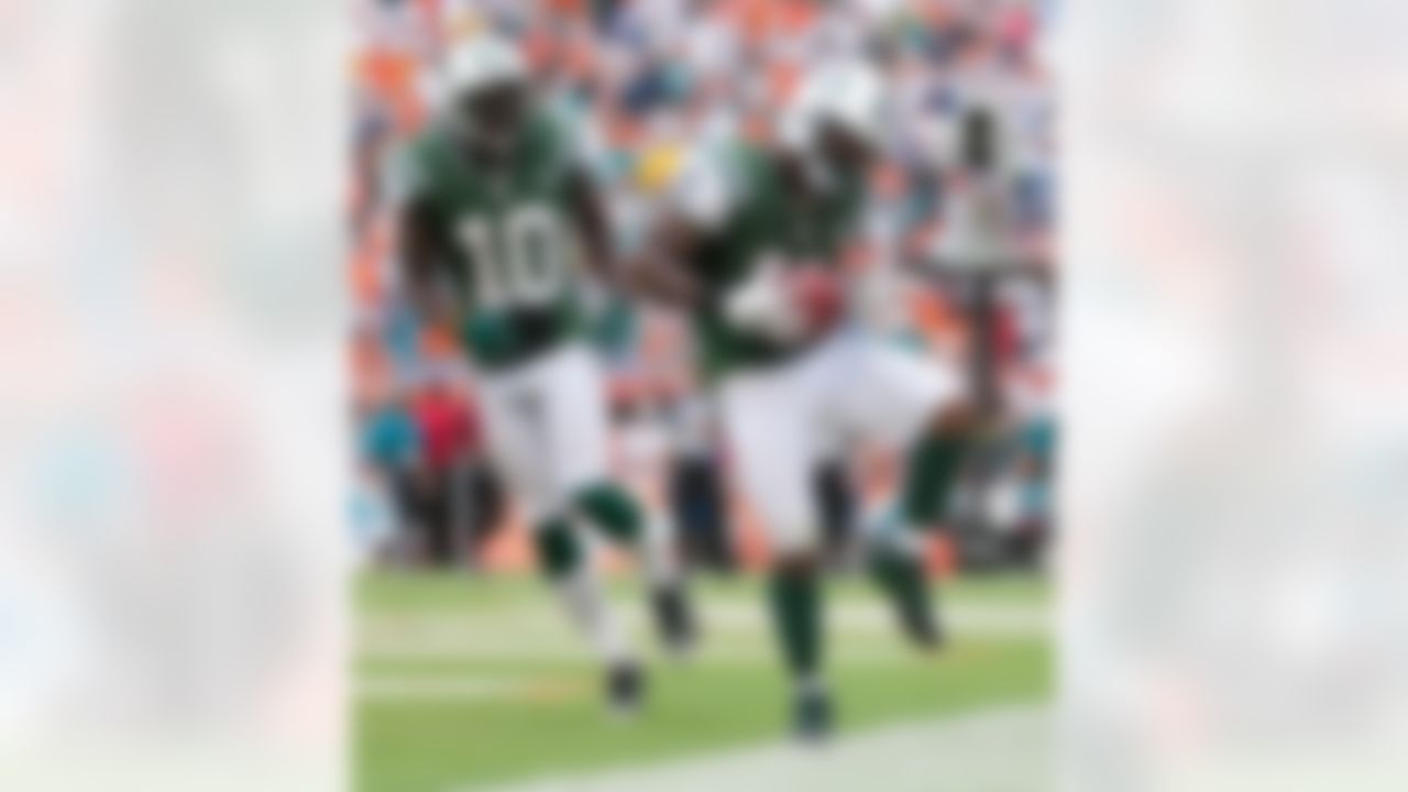 New York Jets wide receiver Jeremy Kerley (11) celebrates a touchdown with wide receiver Santonio Holmes (10) during an NFL football game against the Miami Dolphins at Sun Life Stadium on Sunday, Sept. 23, 2012 in Miami Gardens, Fla. The Jets won 23-20. (Perry Knotts/NFL)