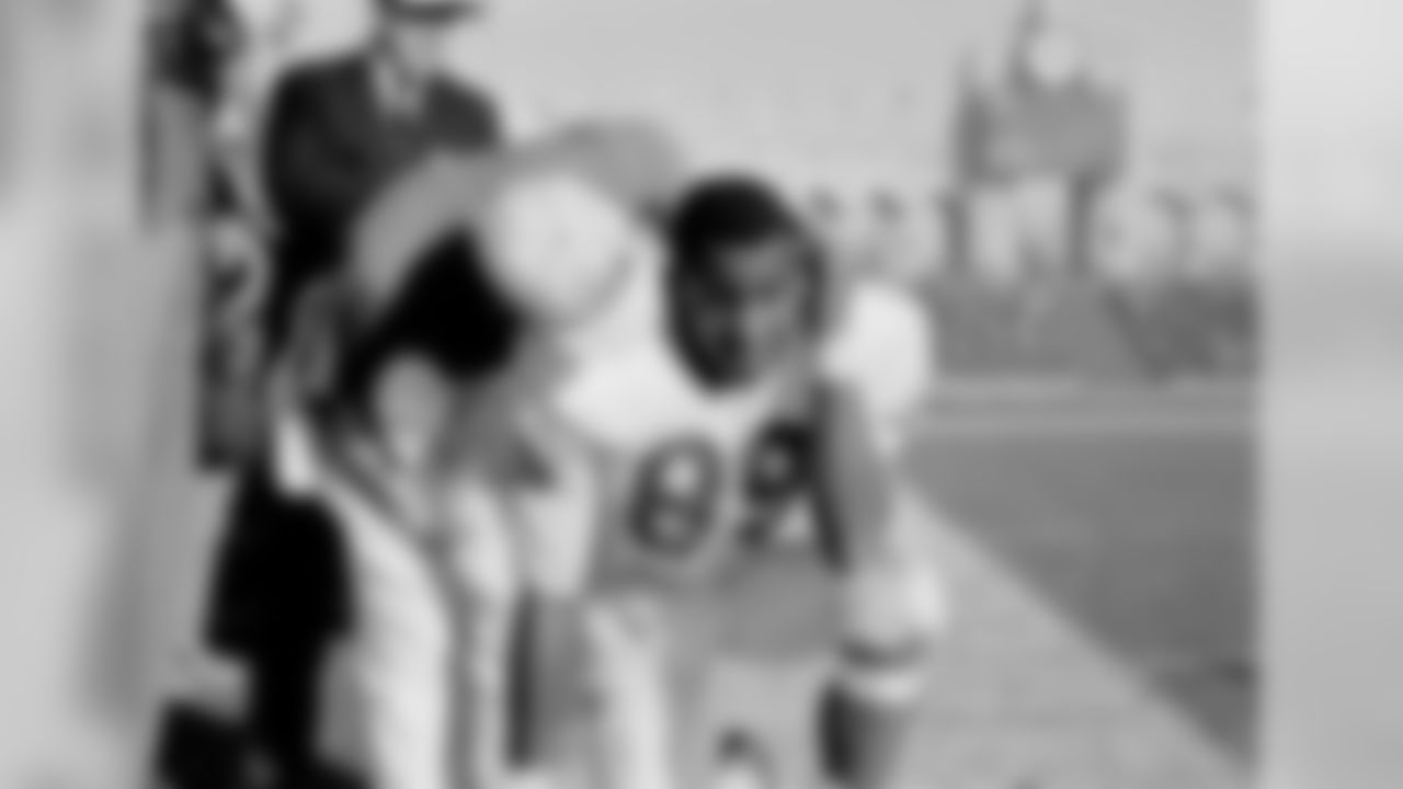 Otis Taylor of the Kansas City Chiefs gets some comforting words from the assistant coach on the sidelines during the Super Bowl at the Los Angeles Memorial Coliseum in Los Angeles, Calif., Jan. 15, 1967. (Associated Press)
