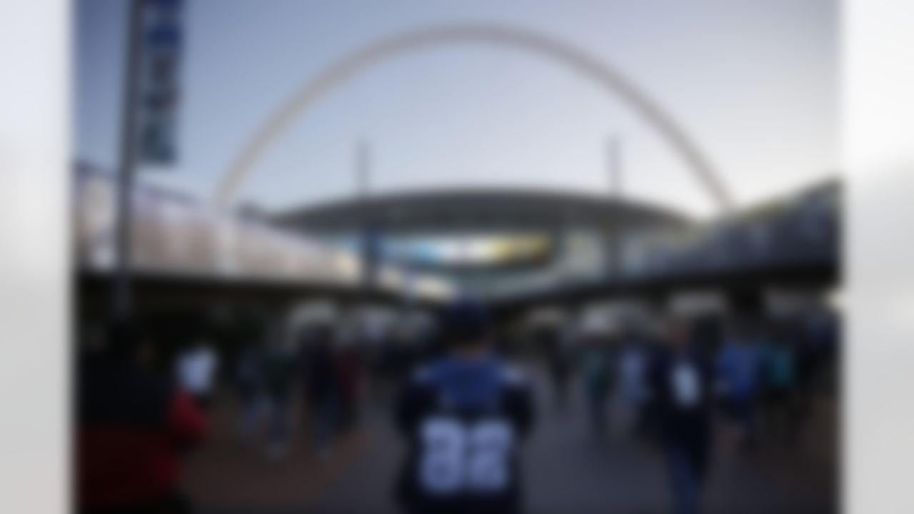 Fans arrive at Wembley Stadium for the NFL football game between the Dallas Cowboys and the Jacksonville Jaguars in London, Sunday, Nov. 9, 2014. (AP Photo/Matt Dunham)