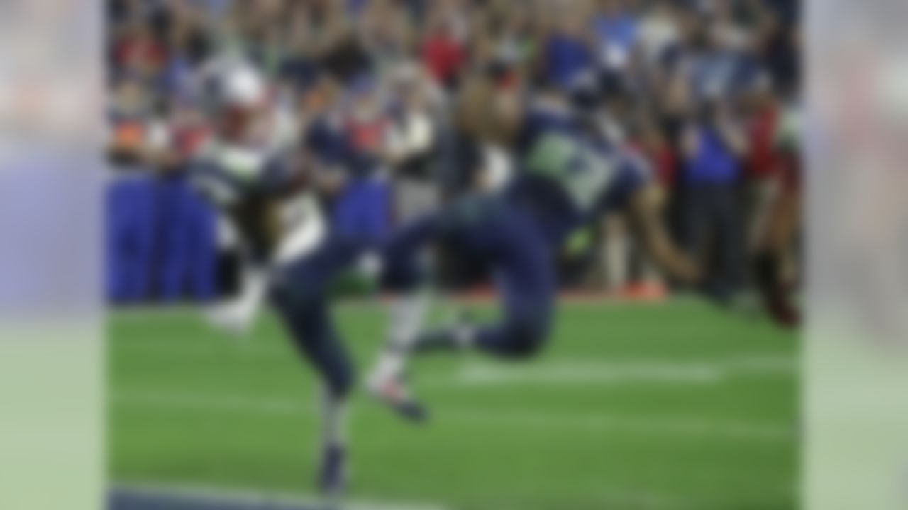 Malcolm Butler's interception of a Russell Wilson pass in the end zone with 20 seconds remaining in the game preserved the Patriots' fourth Super Bowl win in the Bill Belichick-Tom Brady era. The Patriots entered the final quarter of play down 10 points to the Seahawks, but Brady rallied New England to victory with two fourth-quarter touchdown passes.