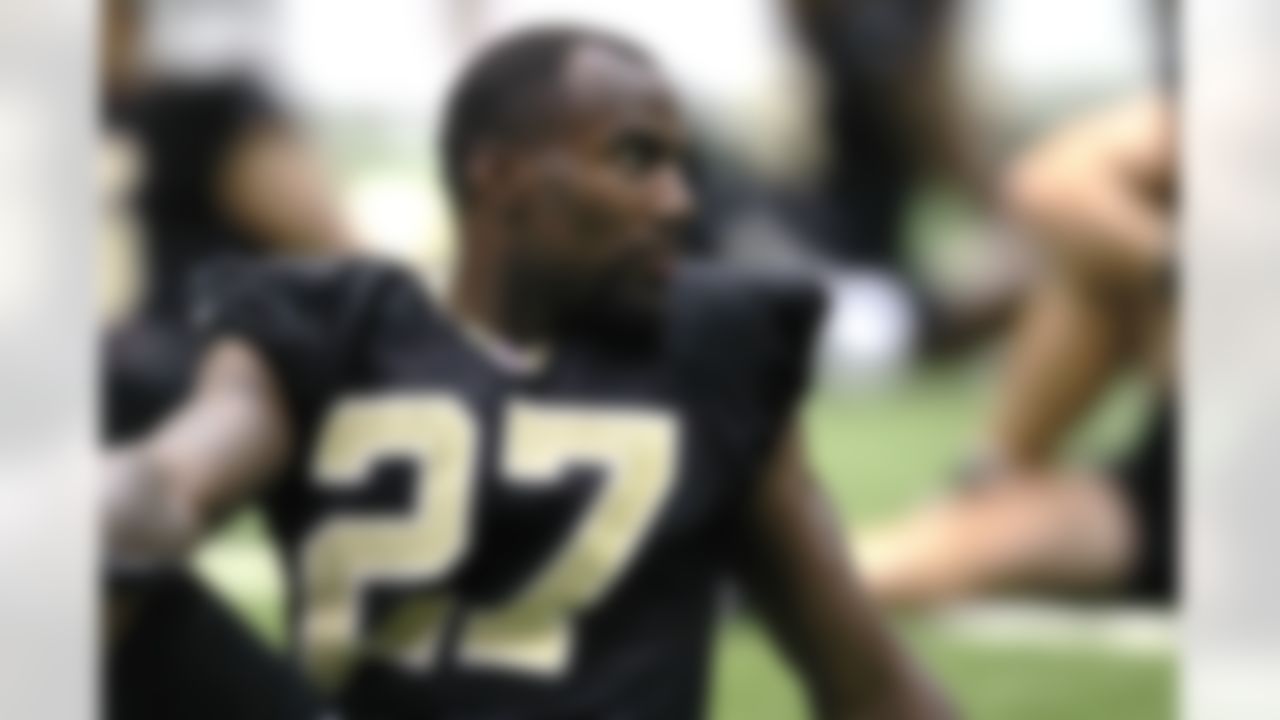 New Orleans Saints free safety Malcolm Jenkins stretches during NFL football training camp in Metairie, La., Thursday, July 26, 2012. (AP Photo/Gerald Herbert)