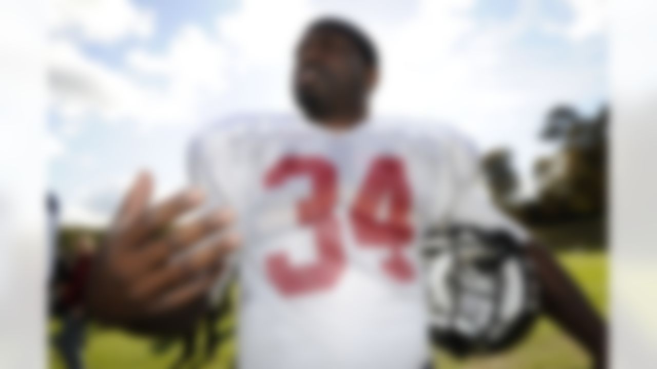 Tampa Bay Buccaneers player Earnest Graham answers a question after a team training session, in Bagshot, west of London, Thursday Oct. 20, 2011. The Buccaneers will face Chicago Bears at London's Wembley stadium on Sunday. (AP Photo/Tom Hevezi)