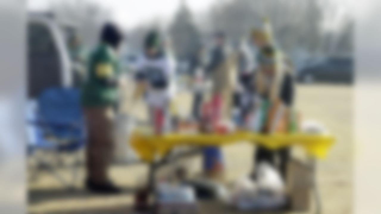 Fans tailgate outside Lambeau Field before an NFL football game between the Green Bay Packers and the Detroit Lions Sunday, Dec. 28, 2014, in Green Bay, Wis. (AP Photo/Tom Lynn)