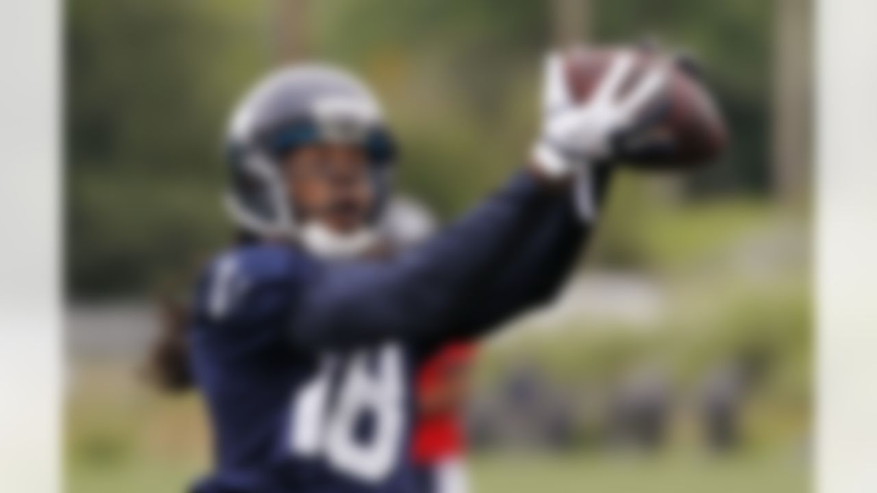 Seattle Seahawks' Sidney Rice reaches for a pass during NFL football practice Tuesday, June 12, 2012, in Renton, Wash. (AP Photo/Elaine Thompson)