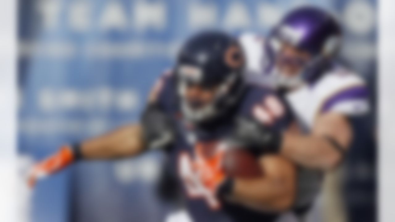 Chicago Bears fullback Evan Rodriguez (48) tackled by Minnesota Vikings linebacker Chad Greenway in the first half of an NFL football game in Chicago, Sunday, Nov. 25, 2012. (AP Photo/Charles Rex Arbogast)