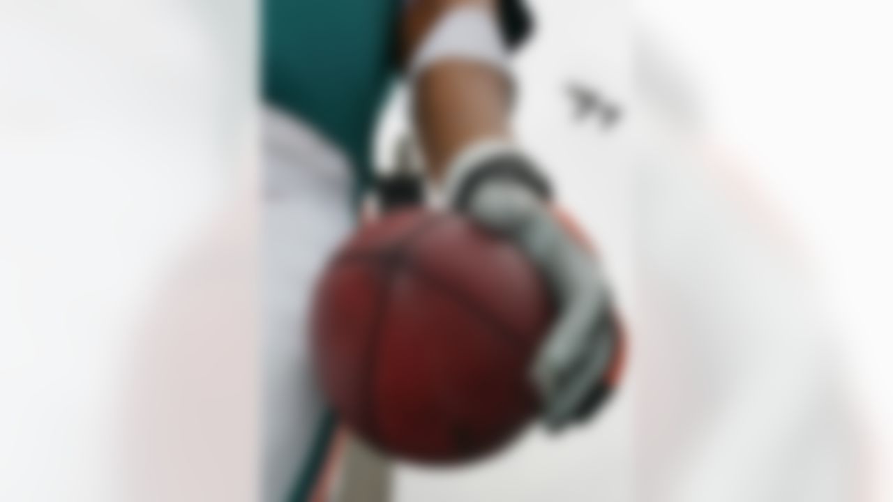 The hand of a 26 foot, 8 meter, animatronic version of Miami Dolphins defensive end Jason Taylor, the biggest animated human figure ever made, holds a football as it is displayed in Trafalgar Square, London, Monday Oct. 22, 2007. The model was unveiled to promote the Miami Dolphins match against the New York Giants match that will be played at Wembley Stadium, London, Sunday Oct. 28, 2007. In background Nelson's column can be seen.(AP Photo/Tom Hevezi)