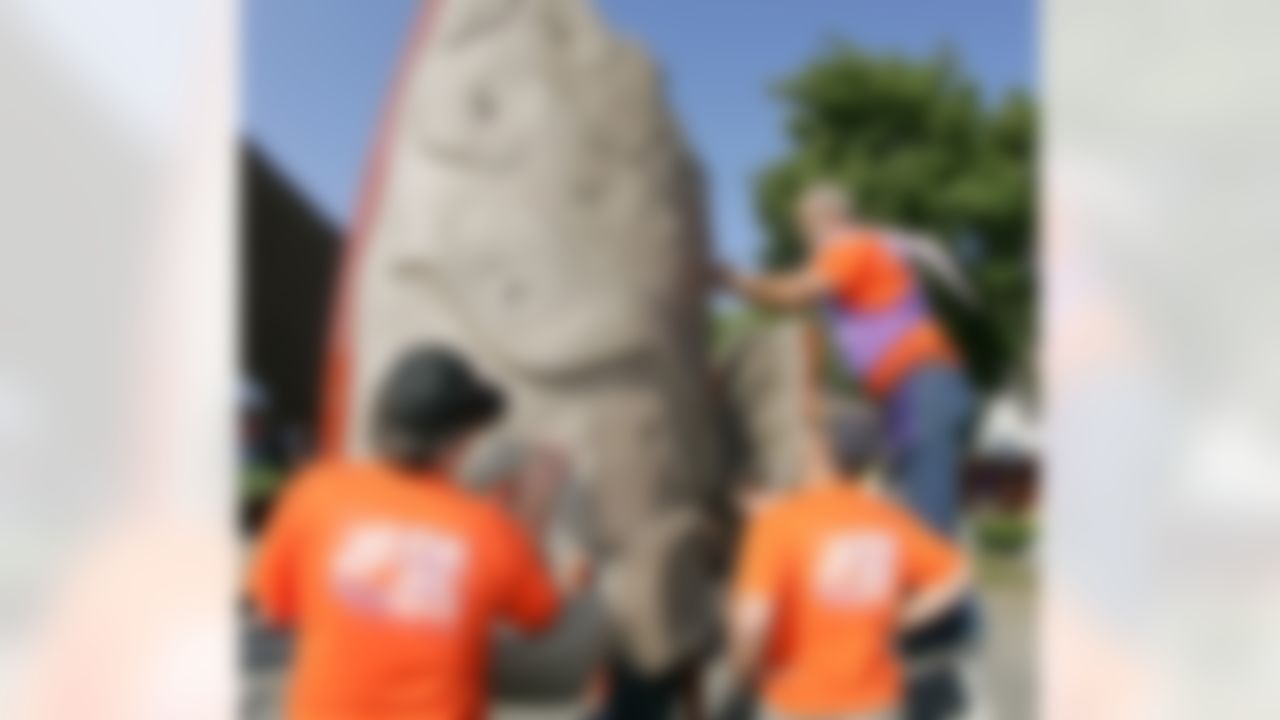 The Home Depot associates and KaBOOM! volunteers put together the climbing wall. (Photo by Alan Marler/CIA Stock Photography, Inc.)