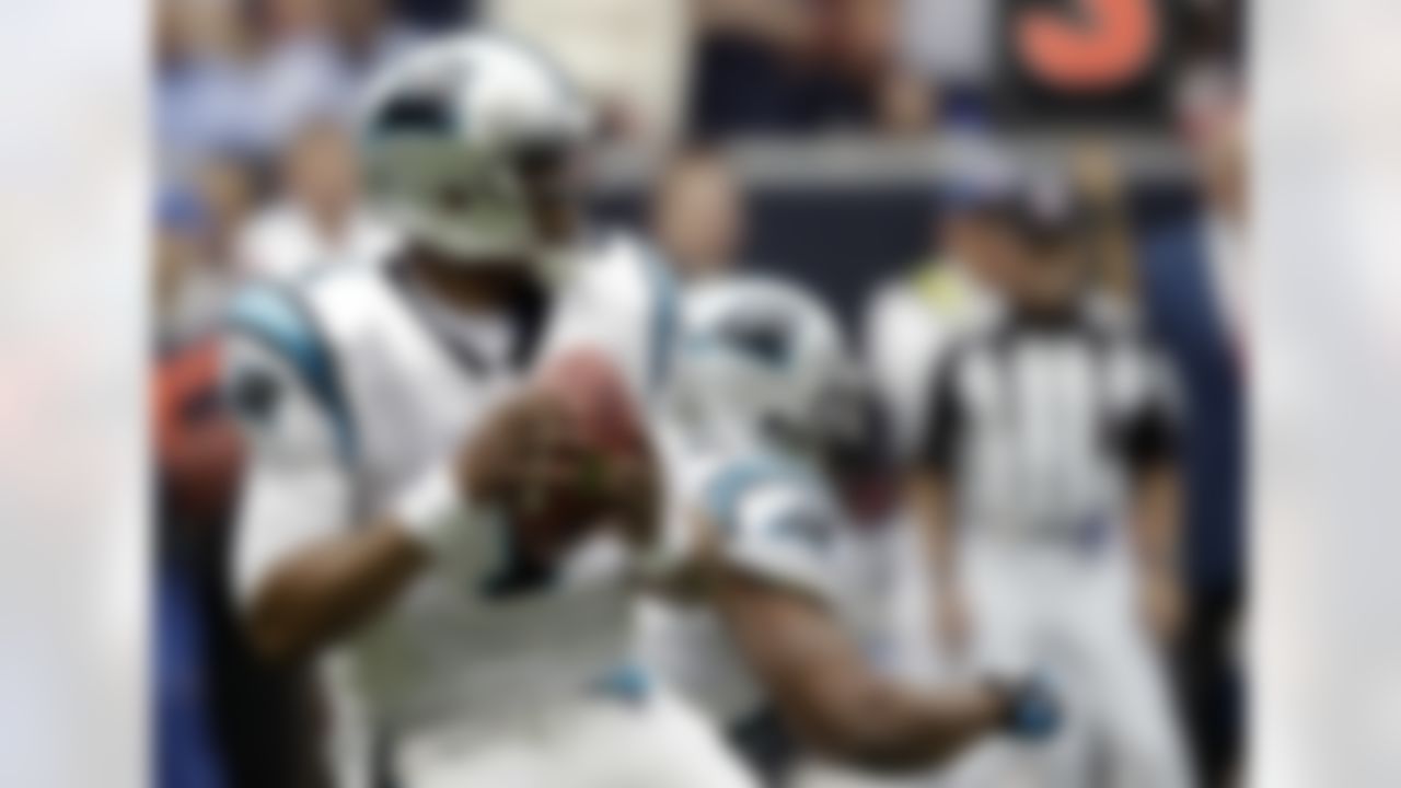Carolina Panthers quarterback Cam Newton drops back to pass in the first quarter of an NFL football game against the Houston Texans, Sunday, Dec. 18, 2011, in Houston. (AP Photo/David J. Phillip)