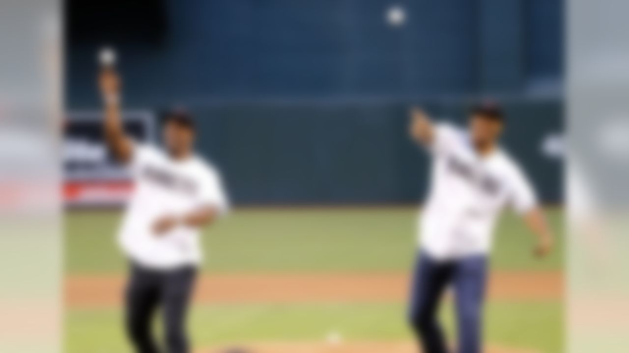 Arizona Cardinals football players Michael Floyd, right, David Johnson throw out the first pitch prior to a baseball game between the Arizona Diamondbacks and the St. Louis Cardinals, Tuesday, April 26, 2016, in Phoenix. (AP Photo/Matt York)