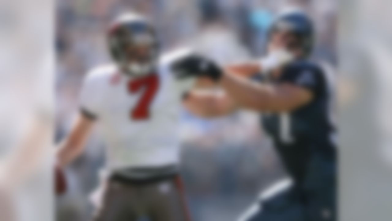 SEATTLE - SEPTEMBER 09: Quarterback Jeff Garcia #7 of the Tampa Bay Buccaneers stiff-arms Patrick Kerney #97 of the Seattle Seahawks at Qwest Field on September 9, 2007 in Seattle, Washington. The Seahawks defeated the Buccaneers 20-6. (Photo by Otto Greule Jr/Getty Images)
