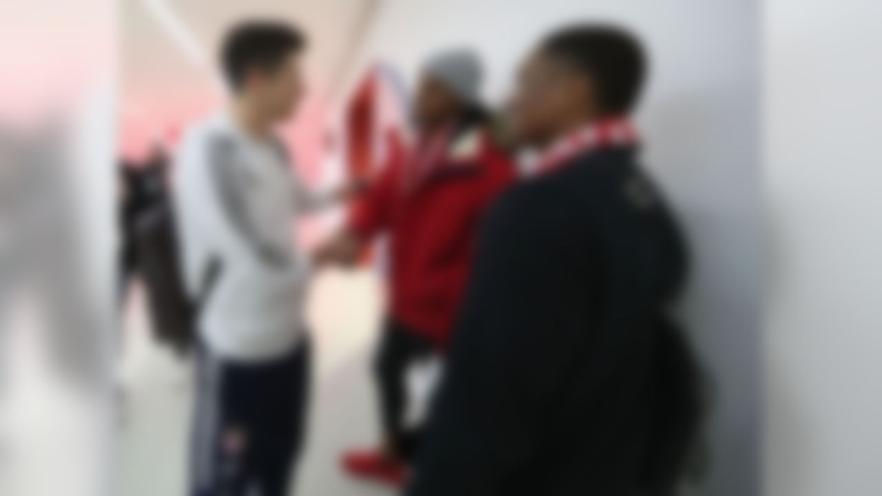 Deshaun Watson meets a soccer player prior to the German Bundesliga soccer match between FC Bayern Munich and Hertha BSC Berlin in Munich, Germany on Saturday, Feb. 24, 2018.