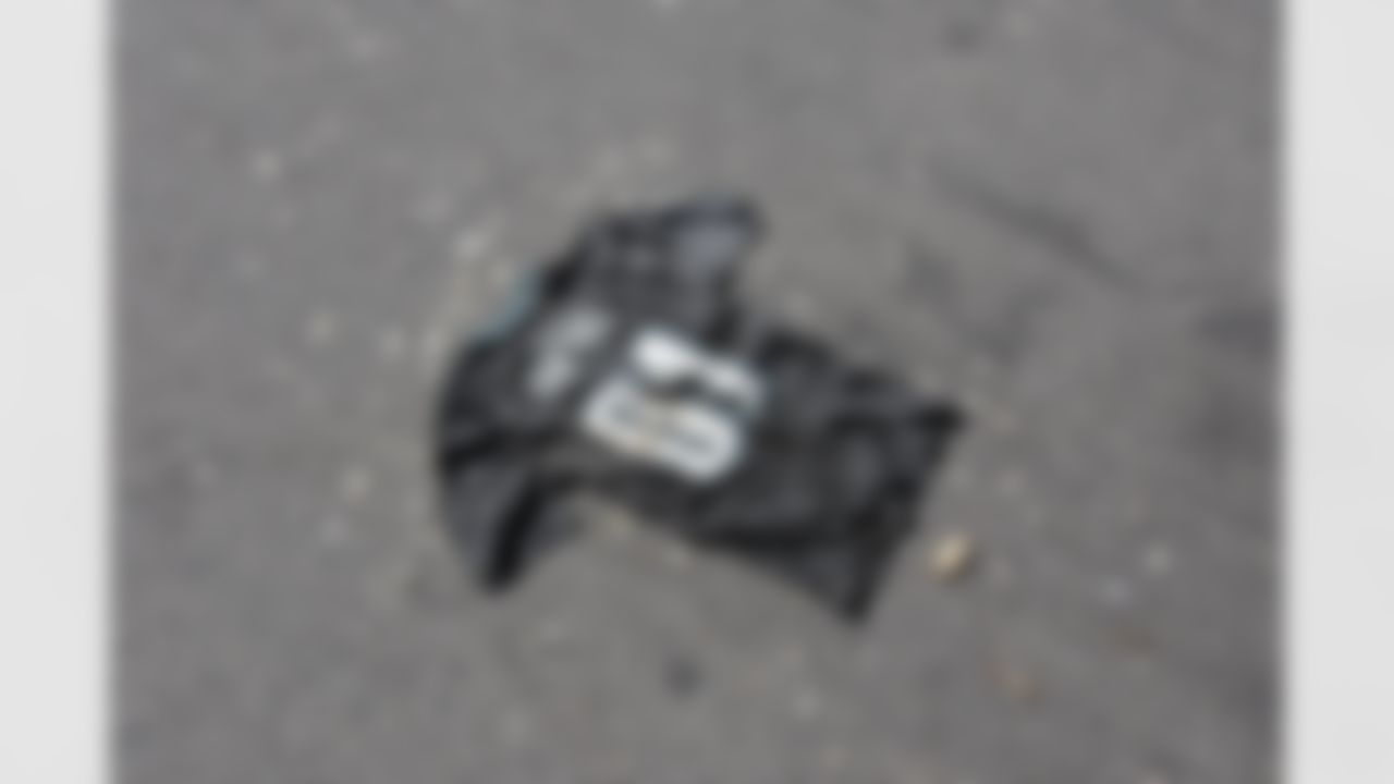 Philadelphia Eagles fans put an old Terrell Owens jersey, surrounded by popcorn, and chicken bones on the parking lot for cars to run over at the Dallas Cowboys game with the Philadelphia Eagles at Lincoln Financial Field in Philadelphia, Pennsylvania on October 8, 2006. Photo by Getty Images.