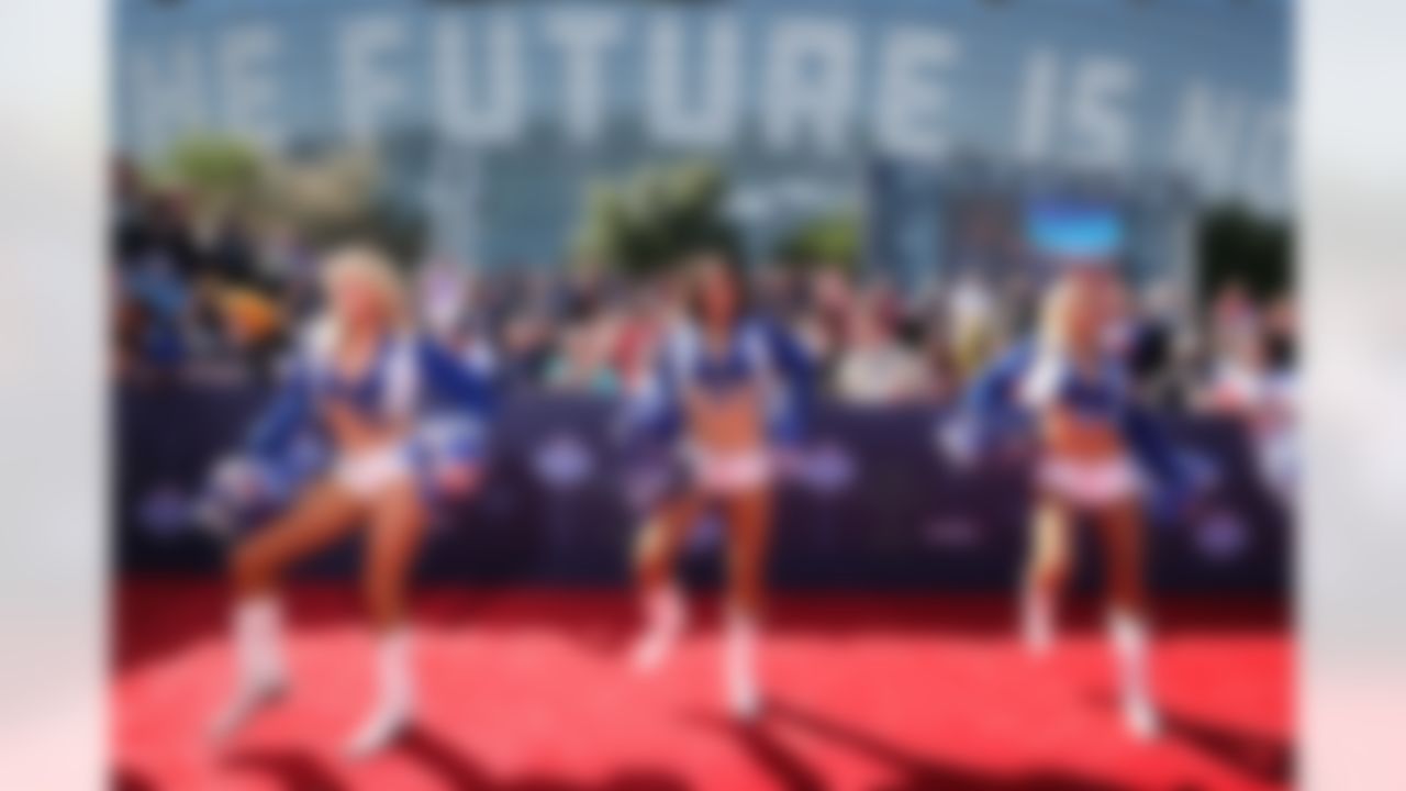 Dallas Cowboys cheerleaders perform on the red carpet.
