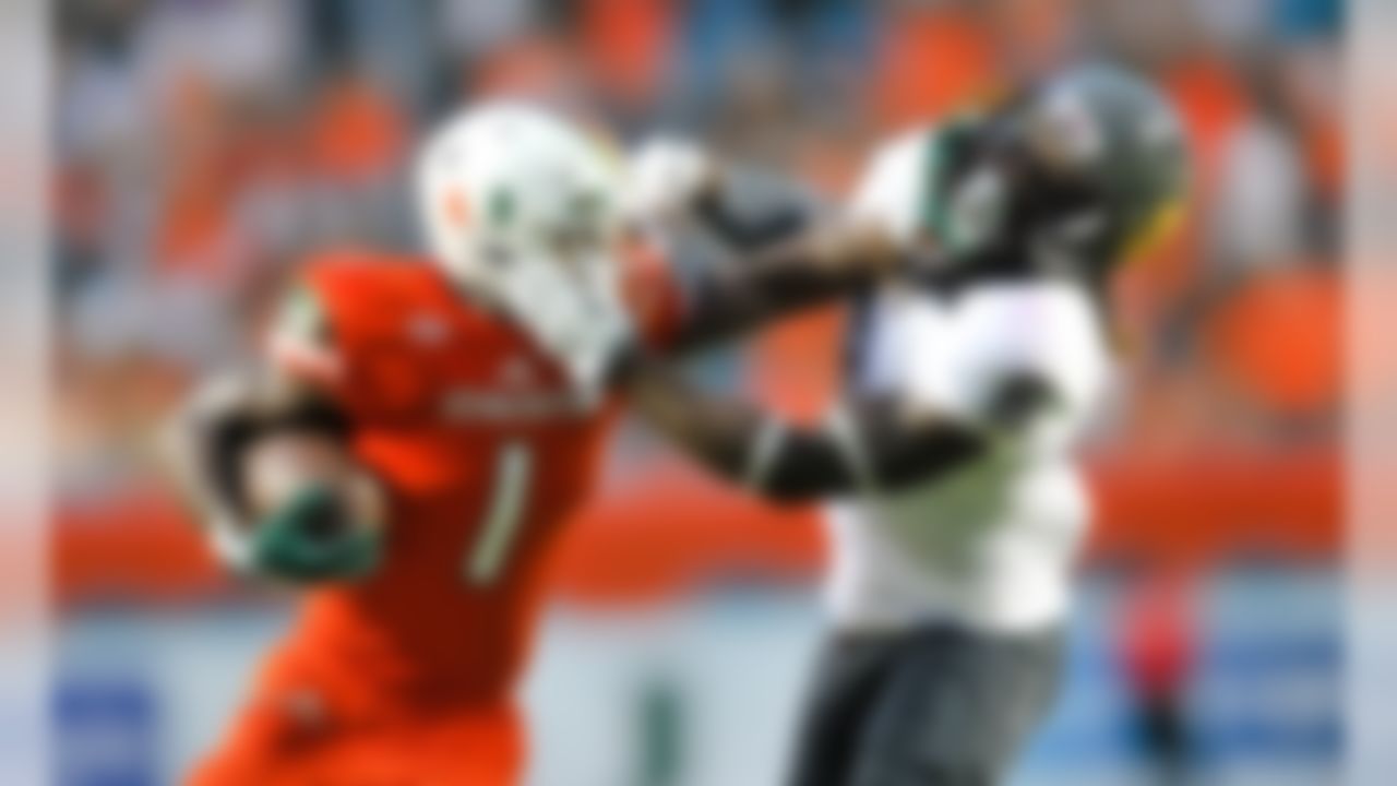 Sep 5, 2015; Miami Gardens, FL, USA; Miami Hurricanes defensive back Artie Burns (1) stiff arm Bethune Cookman Wildcats defensive back Marquis Drayton (6) during the first half at Sun Life Stadium. Mandatory Credit: Steve Mitchell-USA TODAY Sports