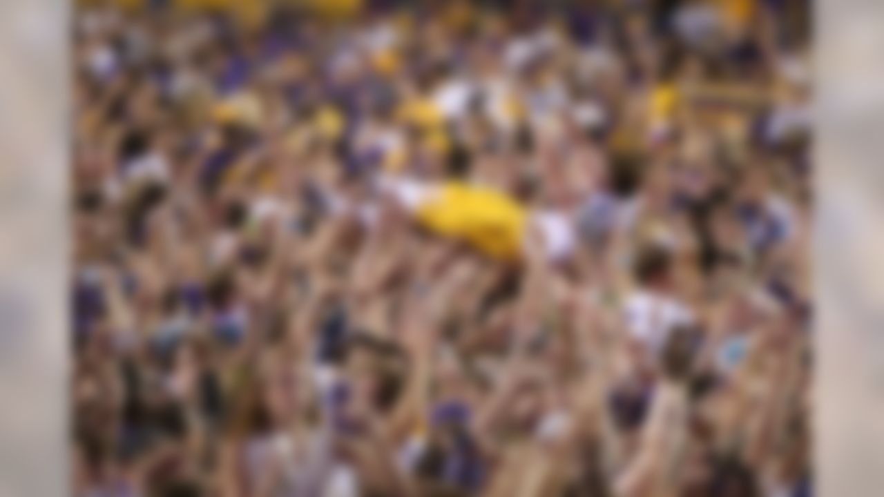 Oct 25, 2014; Baton Rouge, LA, USA; LSU Tigers wide receiver Trey Quinn (8) crowd surfs after fans stormed the field following the Tigers 10-7 victory agains the Mississippi Rebels at Tiger Stadium. Mandatory Credit: Crystal LoGiudice-USA TODAY Sports