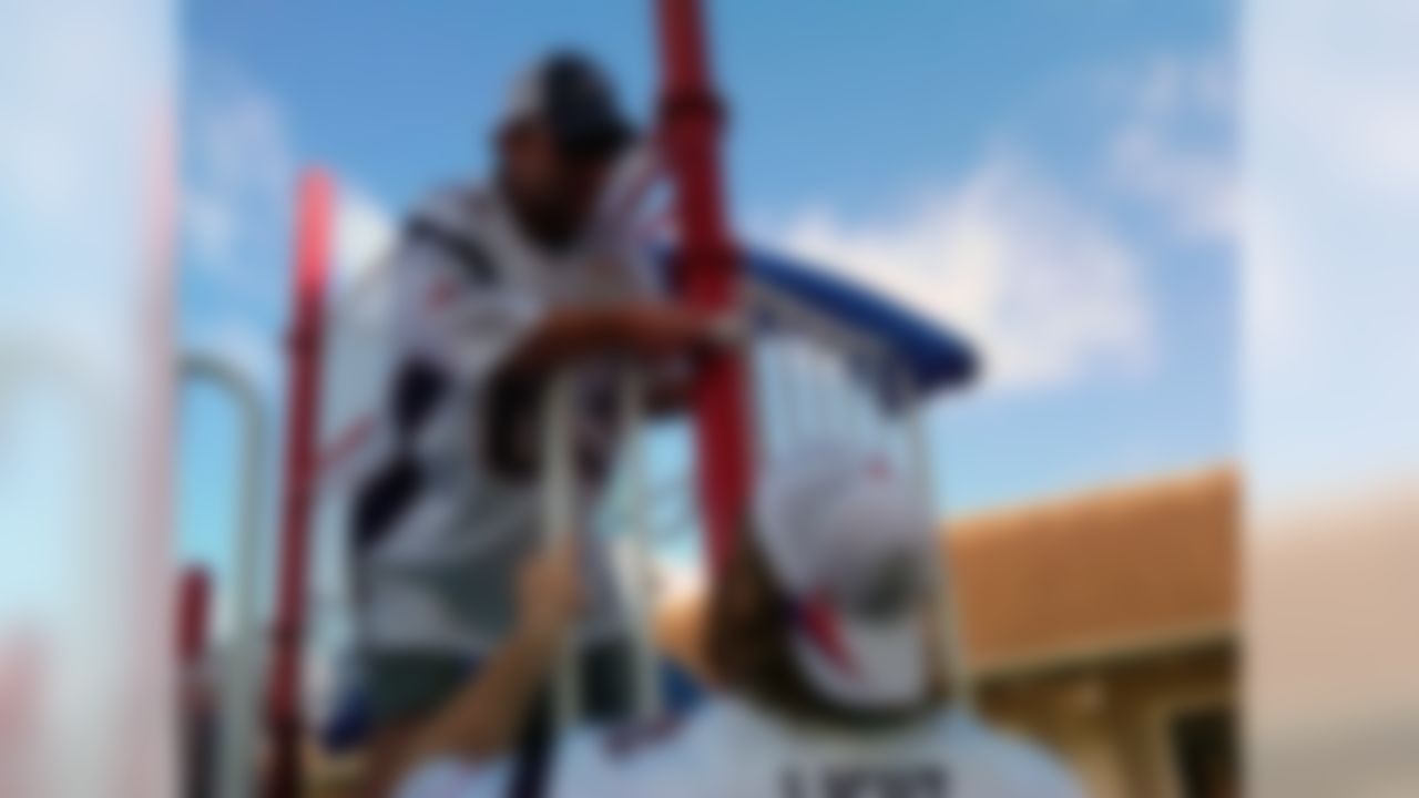 New England Patriots wide receiver Wes Welker (left) and tackle Matt Light (right) help build a playground during an NFL Play 60 event. (National Football League)