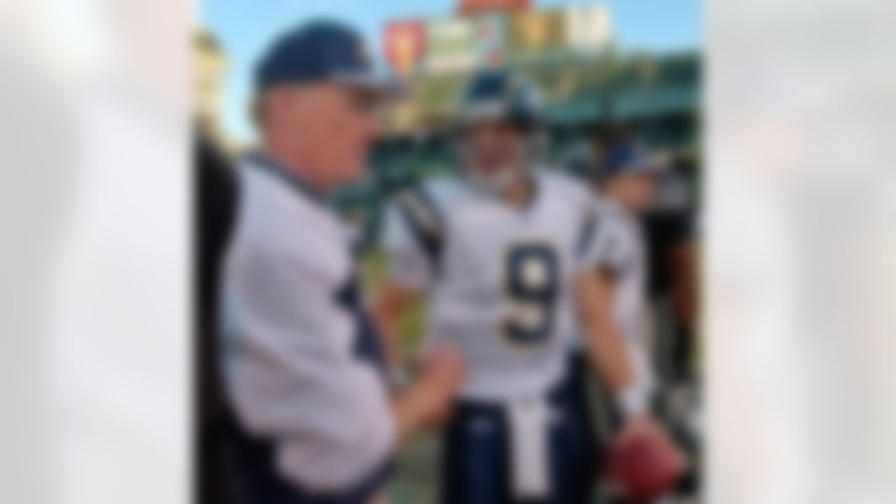 San Diego Chargers coach Marty Schottenheimer, left, shakes hands with quarterback Drew Brees (9) after the Chargers defeated the Raiders 23-17 Sunday, Nov. 21, 2004, in Oakland, Calif. At right is quarterback Doug Flutie (7). (AP Photo/Paul Sakuma)