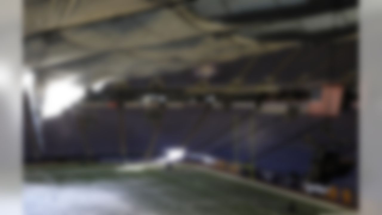 Snow falls into the field from a hole in the collapsed roof of the Metrodome in Minneapolis Sunday, Dec. 12, 2010. The inflatable roof of the Metrodome collapsed Sunday after a snowstorm that dumped 17 inches (43 cms) on Minneapolis. No one was hurt, but the roof failure sent the NFL scrambling to find a new venue for the Vikings' game against the New York Giants. (AP Photo/Ann Heisenfelt)