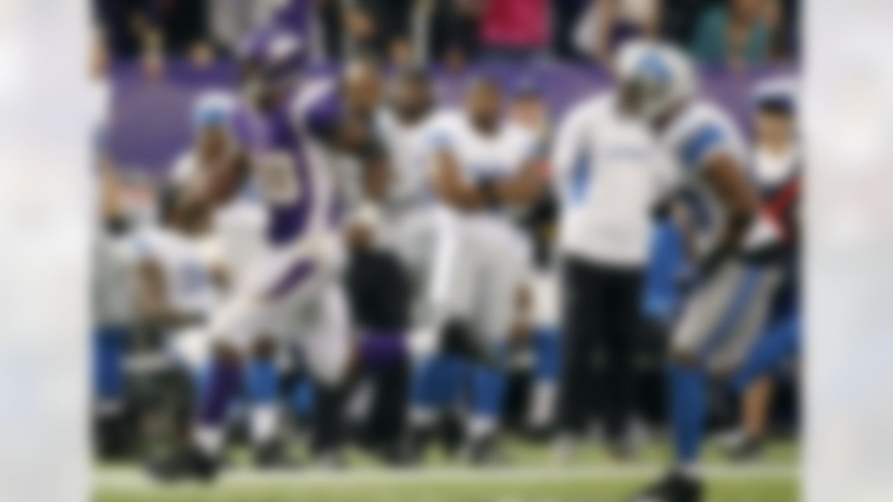 Minnesota Vikings running back Adrian Peterson, left, eludes Detroit Lions safety Ricardo Silva to score on a 61-yard touchdown run in the second half of an NFL football game, Sunday, Nov. 11, 2012, in Minneapolis. (AP Photo/Genevieve Ross)