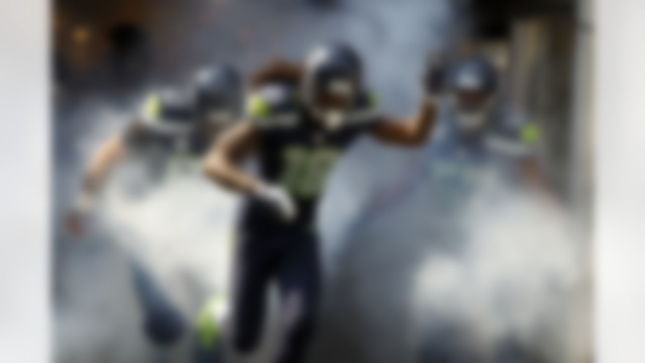 Seattle Seahawks wide receiver Sidney Rice (18) runs out the tunnel before the game against the against the Dallas Cowboys at CenturyLink Field on Sunday, September 16, 2012 in Seattle, Washington. (AP Photo/Jon Ferrey)