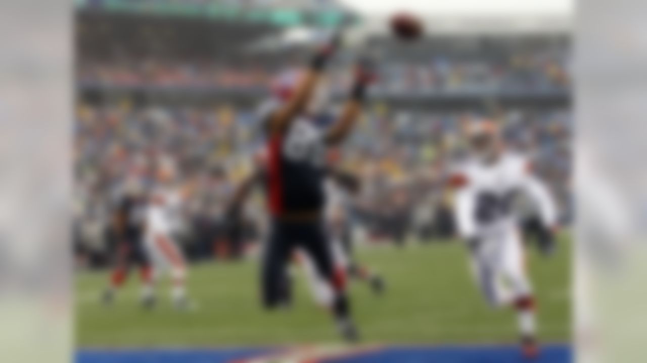 Buffalo Bills' David Nelson (86) catches a touchdown pass under pressure from Cleveland Browns' Mike Adams (20) during the first half of an NFL football game in Orchard Park, N.Y., Sunday, Dec. 12, 2010. (AP Photo/David Duprey)