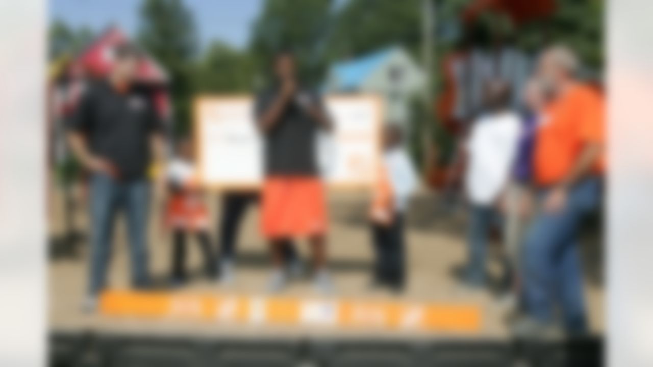 Braylon Edwards speaks to the more than 225 Home Depot associates and KaBOOM! volunteers about the importance of giving back to your community. (Photo by Alan Marler/CIA Stock Photography, Inc.)