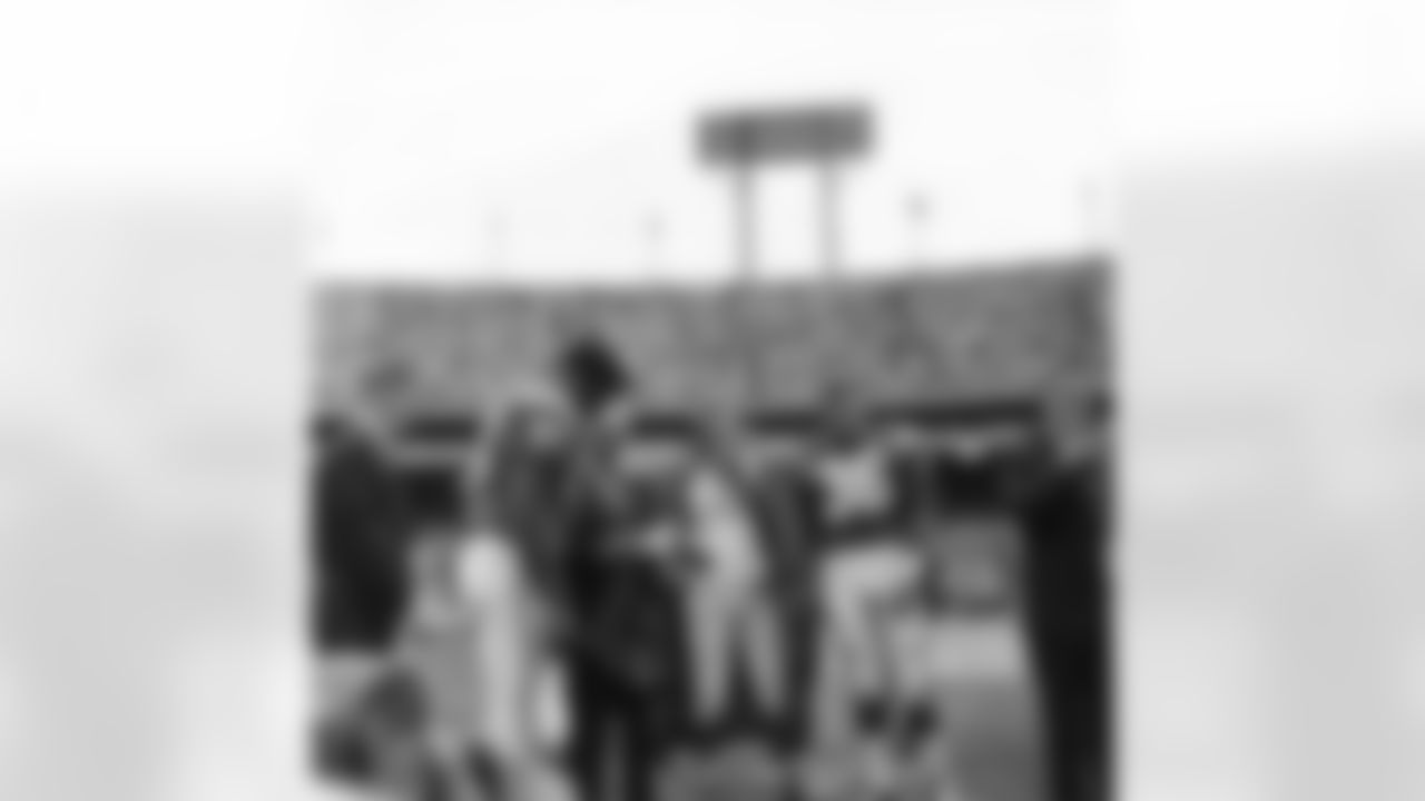 Veteran defensive tackle Art Donovan brushes a tear from his eye during pre-game ceremonies on Sept. 16, 1962 in Baltimore, Maryland in which the former All-Pro was honored by the Baltimore Colts. Teammates Gino Marchetti (left) and Bill Pellington stand with Colt President Carroll Rosenbloom, shown holding Donovan's number 70 jersey which has been retired. (Associated Press)