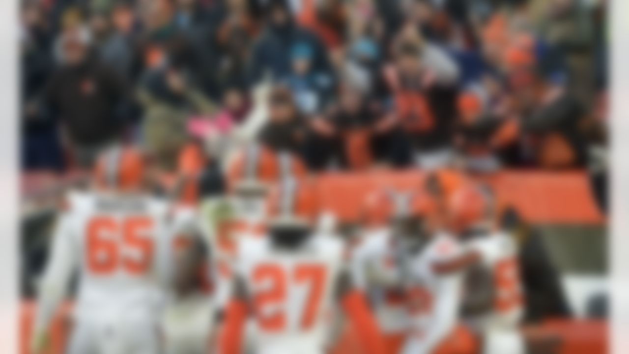 Cleveland Browns fans celebrate as Browns players walk off the field after defeating the Carolina Panthers in an NFL football game, Sunday, Dec. 9, 2018, in Cleveland.
