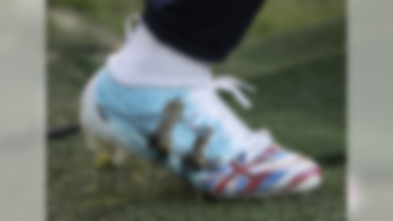 One of the boots of Tennessee Titans quarterback Marcus Mariota as he warms up before an NFL football game against the Los Angeles Chargers at Wembley stadium in London, Sunday, Oct. 21, 2018.