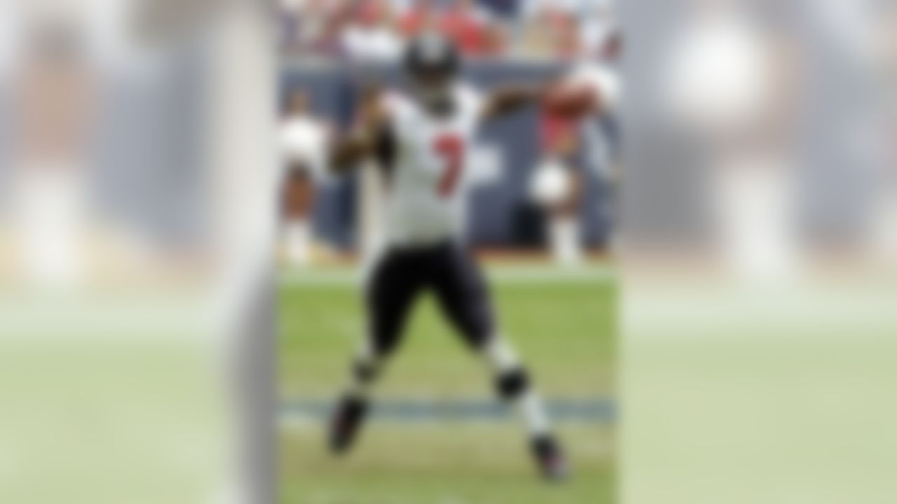 Atlanta Falcons quarterback Michael Vick drops back to pass in the third quarter against the Houston Texans, Sunday, Nov. 30, 2003, in Houston. Vick made his long-delayed season debut for Atlanta after missing 15 weeks because of a broken right leg suffered in the preseason. (AP Photo/Brett Coomer)