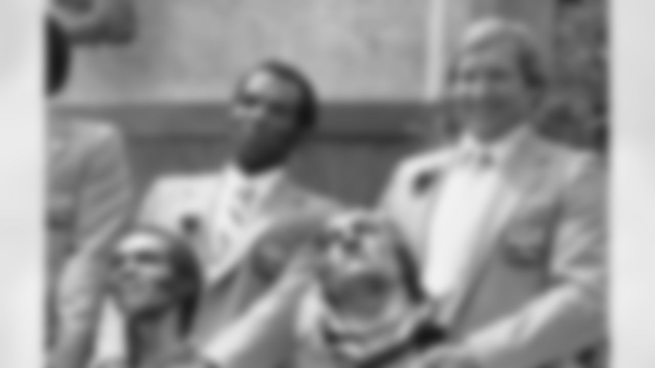 Former Green Bay Packers cornerback Herb Adderley, left, and Wausau native Jim Otto, a standout center with the Oakland Raiders, pose with their statues after enshrinement in the Pro Football Hall of Fame in Canton, Ohio, Aug. 2, 1980. (AP Photo)