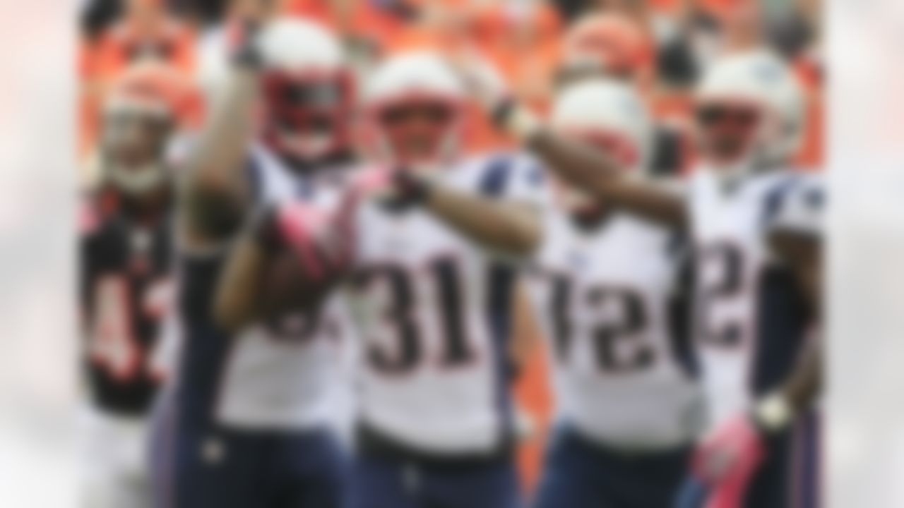 New England Patriots cornerback Aqib Talib (31) celebrates against the Cincinnati Bengals in an NFL football game, Sunday, Oct. 6, 2013, in Cincinnati. (AP Photo/Tom Uhlman)