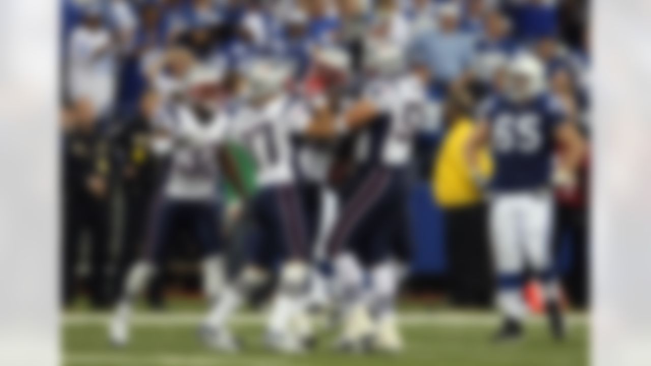 INDIANAPOLIS - NOVEMBER 04: Rosevelt Colvin #59 (C) of the New England Patriots celebrates with teammates after he recovered a fumble by Peyton Manning #18 of the Indianapolis Colts late in the fourth quarter of their game on November 4, 2007 at the RCA Dome in Indianapolis, Indiana. The Patriots won 24-20. (Photo by Andy Lyons/Getty Images)