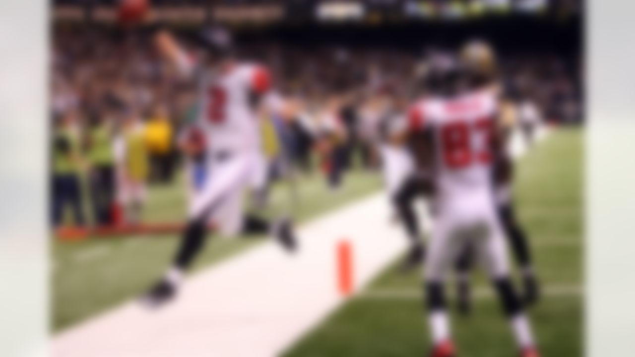 Rookie quarterback Matt Ryan #2 of the Atlanta Falcons runs for a fourth quarter touchdown to give the Falcons a 25-22 lead over the New Orleans Saints at the Louisiana Superdome on December 7, 2008 in New Orleans, Louisiana. The Saints defeated the Falcons 29-25. (AP Photo/Paul Spinelli)