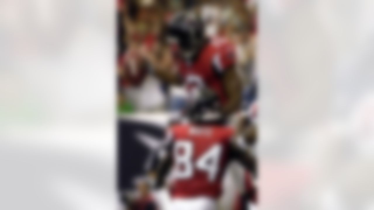 ATLANTA, GA - SEPTEMBER 30: Wide receiver Michael Jenkins #12 of the Atlanta Falcons celebrates a touchdown catch against the Houston Texans at the Georgia Dome on September 30, 2007 in Atlanta, Georgia. The Falcons won 26 - 16. (Photo by Al Messerschmidt/Getty Images)