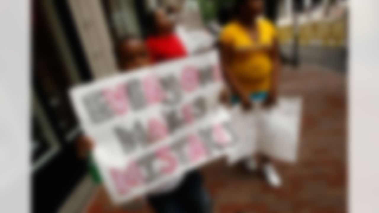 RICHMOND, VA - AUGUST 27: Nine-year-old Jerron Lofton shows his support for Atlanta Falcons quarterback Michael Vick outside federal court August 27, 2007 in Richmond, Virginia. The football star is expected to plead guilty to a federal dogfighting conspiracy charge. The NFL has suspended Vick indefinitely. (Photo by Win McNamee/Getty Images)