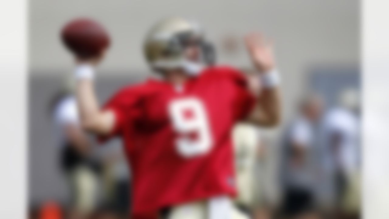 New Orleans Saints quarterback Drew Brees passes during NFL football training camp in Metairie, La., Saturday, July 28, 2012. (AP Photo/Gerald Herbert)