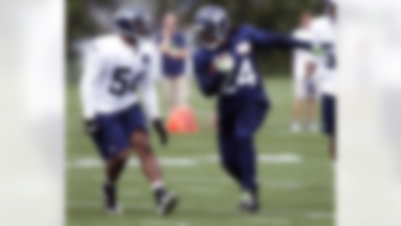 Seattle Seahawks running back Marshawn Lynch (24) runs the ball past rookie linebacker Bobby Wagner (54) on Saturday, July 28, 2012, on their first day of NFL football training camp in Renton, Wash. (AP Photo/Ted S. Warren)