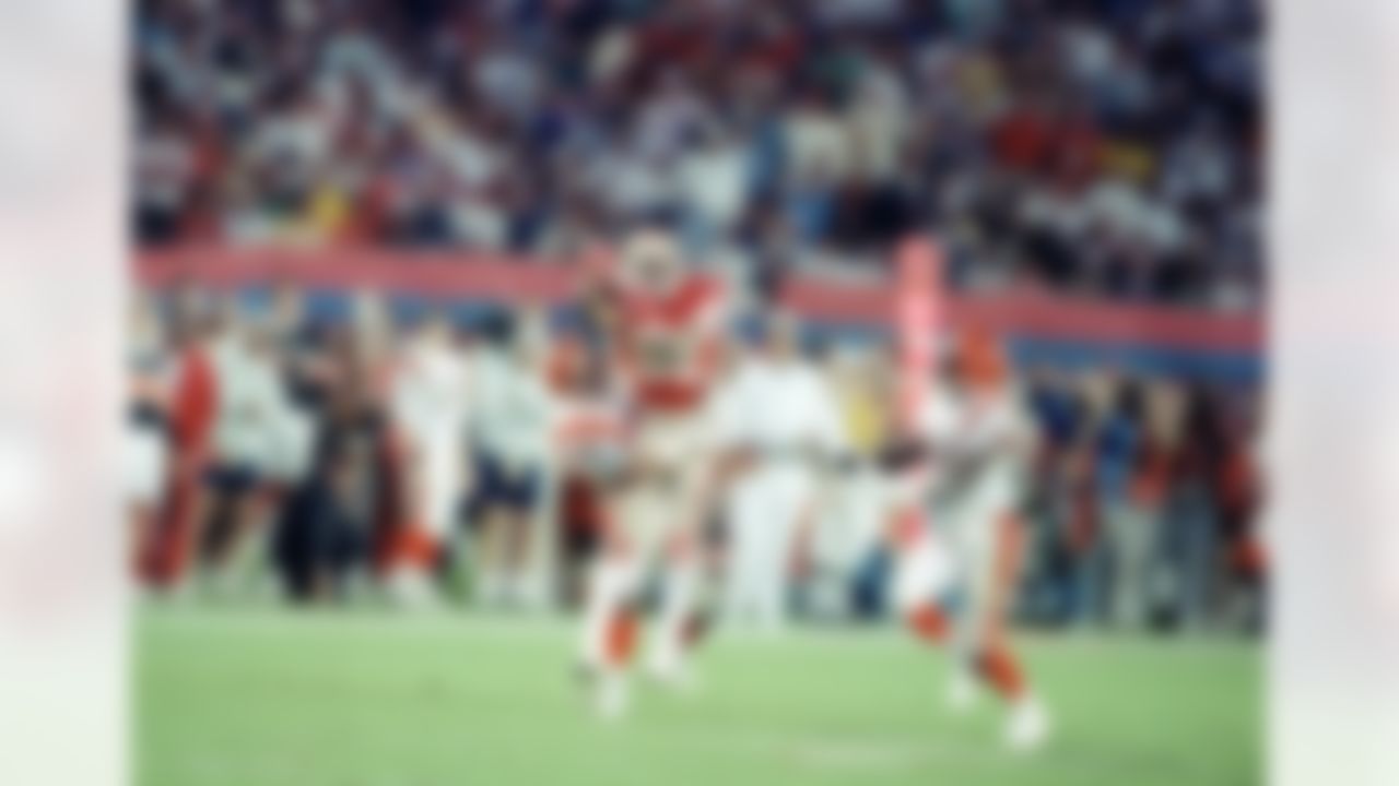 San Francisco 49ers wide receiver Jerry Rice (80) is surrounded by Cincinnati Bengals defenders, cornerback Lewis Billups, left, and safety Ray Horton, as he pulls in a long pass during the fourth quarter of Super Bowl XXIII at Joe Robbie Stadium in Miami, Fla., Sunday, Jan. 22, 1989. Rice was named Most Valuable Player after the 49ers won, 20-16. (AP Photo/Phil Sandlin)