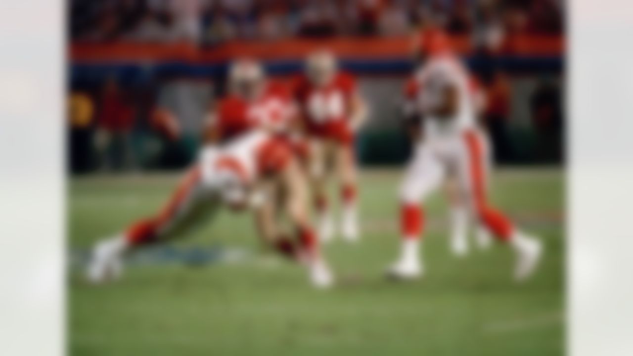 San Francisco 49ers Roger Craig (33) fumbles the ball after being hit by Cincinnati Bengals Barney Bussey (27) during the second quarter of Super Bowl XXIII in Miami on Sunday, Jan. 22, 1989. The Bengals recovered. (AP Photo/Rusty Kennedy)